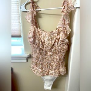 Pink body suit